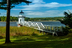 Doubling Point Light Juts Out From Wooded Area in Maine